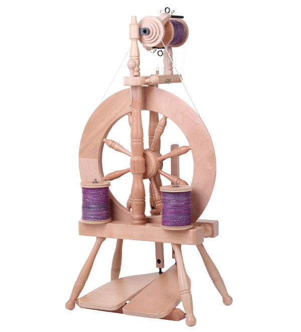 The Good Yarn Ashford Traveller 3 Spinning Wheel with bobbins and purple yarn