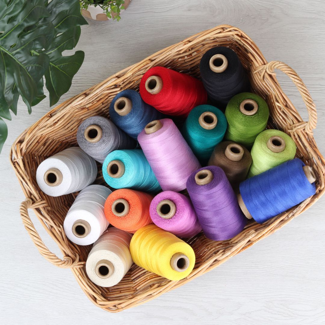 The Good Yarn Ashford Weaving Cotton Mercerised Unmercerised Yoga Yarn 10/2 5/2 8/2 on table