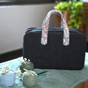 The Good Yarn Bloom Doctor Bag Large on table with wool