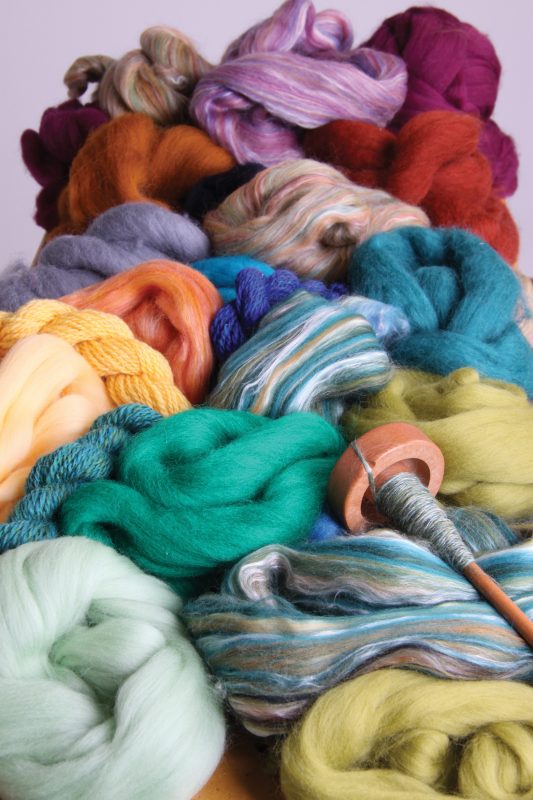 The Good Yarn Coloured Wool fibres with drop spindle